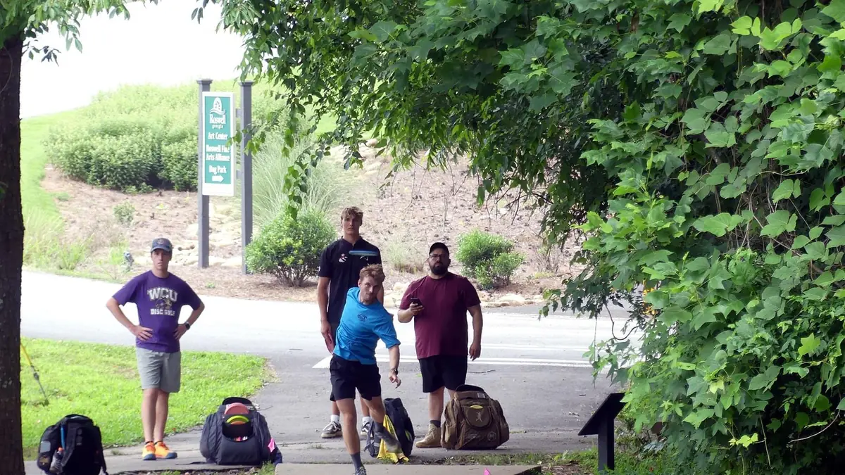 League members waiting at the teepad between throws